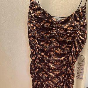Selling a dress colored black with peach flowers